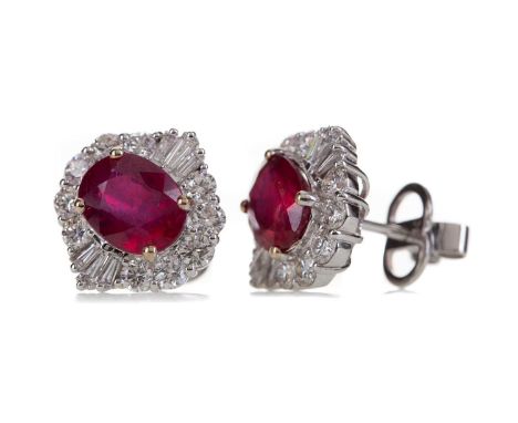 PAIR OF CERTIFICATED TREATED RUBY AND DIAMOND EARRINGS,set with oval treated rubies of approximately 5.54 carats overall, fla