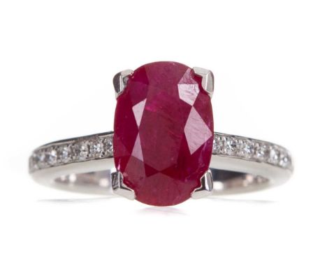 RUBY AND DIAMOND RING,the oval ruby of approximately 2.75 carats, on diamond shoulders totalling approximately 0.44 carats, m