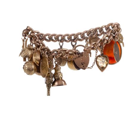 GOLD CHARM BRACELET,the curb links marked 9, with charms including a swivel fob compass, gold 10 francs coin dated 1866, a ca