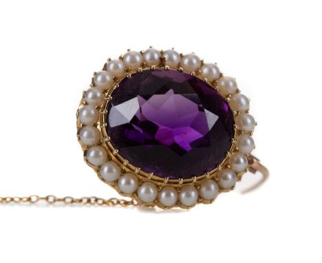 EDWARDIAN AMETHYST AND PEARL BROOCH,set with an oval faceted amethyst within a split pearl border, unmarked, dated 20/9/1907,