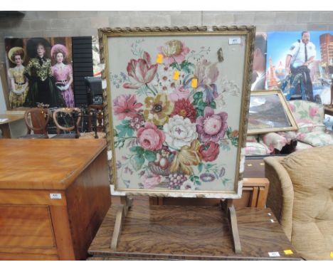 A vintage folding firescreen