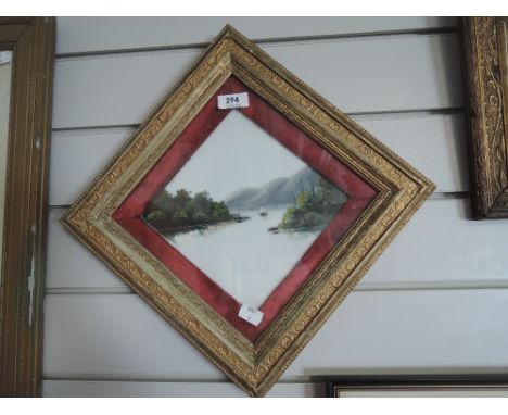 A piece of vintage hand painted glass with ornate frame
