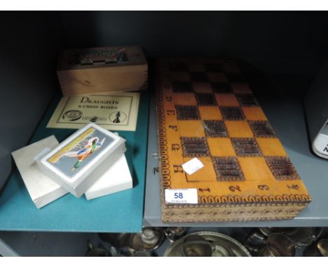 A selection of vintage board games including chess set 