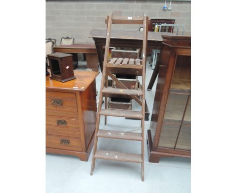 A set of vintage wooden stepladders
