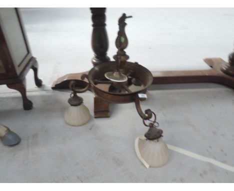 A vintage ceiling light fitting and opaque glass shades