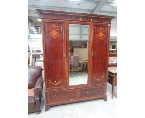 An Edwardian mahogany mirror panel wardrobe and a similar washstand