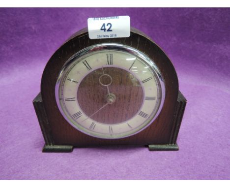 A vintage oak body mantle clock small size