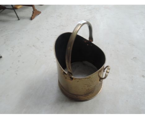 A vintage brass coal helmet
