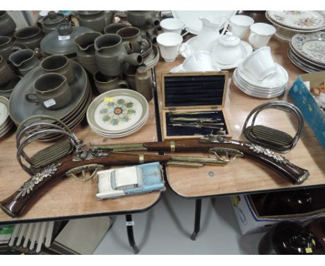 A selection of vintage curios and trinkets including replica pistol set 