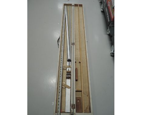 A vintage surveyors rule and tripod