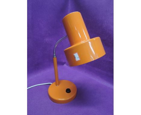 A vintage table top lamp in retro orange
