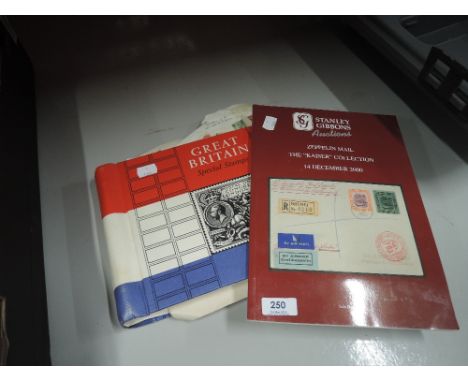 A selection of vintage stamps and reference book