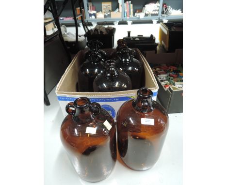 A selection of vintage demi jars or jugs in brown glass