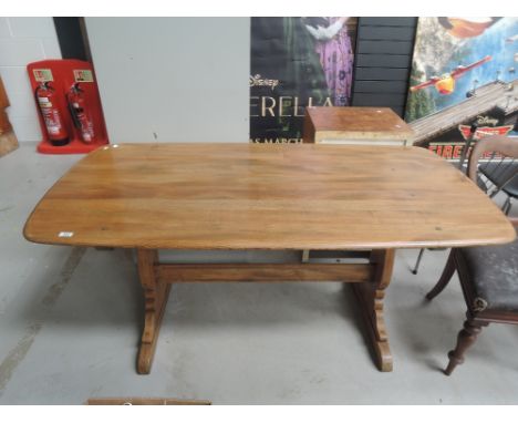 An Ercol style mid colour dining tableCR - 30" wide, 60" long 28" height. Not extendable table, overall good condition.