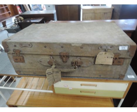 A vintage travel case bearing Royal Air Force baggage labels etc
