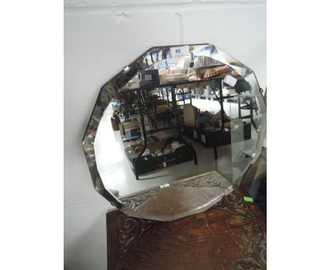 A vintage hall way mirror with cut and bevel edged glass