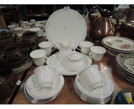 A part tea service by Royal Doulton in the Carnation pattern 20 pieces approx