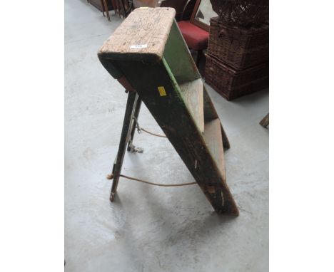 A set of vintage wooden low step ladders