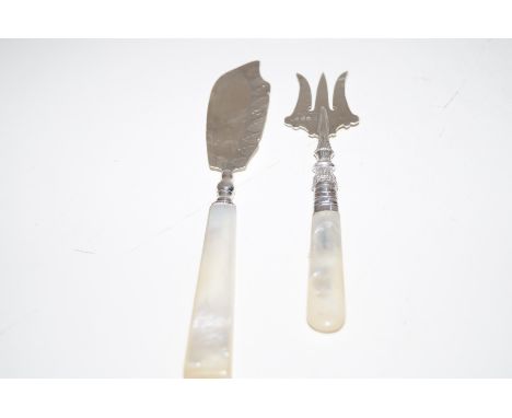 2 silver mother of pear handled fork and crumb knife. 