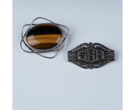 This lot features two exquisite sterling silver brooches, each with unique designs and craftsmanship. The Art Deco Sterling S