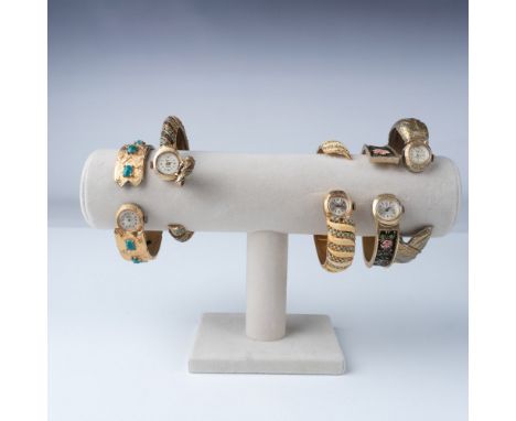 This lot features a set of five exquisite hidden watch bracelets, showcasing intricate craftsmanship from the mid-20th centur