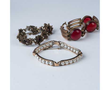 This lot features three vintage bracelets, each with its own unique design and craftsmanship. The first bracelet showcases bo