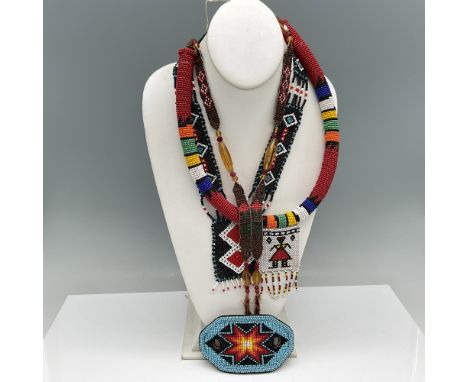 A beautifully crafted Native American-style jewelry, featuring intricate hand-beaded designs in vibrant colors. This lot incl