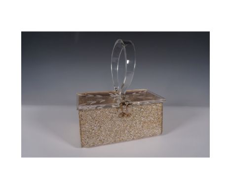 Mid-century Lucite box handbag featuring a dazzling gold confetti design with a clear etched floral lid. The structured desig