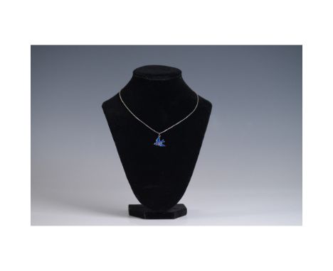 This delicate necklace features a sterling silver bird pendant adorned with vibrant blue and red enamel, marked "sterling" on