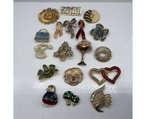 A vibrant collection of 18 assorted enamel and gold-tone brooches and pins featuring a variety of themes, including floral de