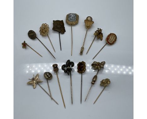 A charming collection of 15 antique vintage stickpins, featuring an array of decorative motifs including florals, insects, an