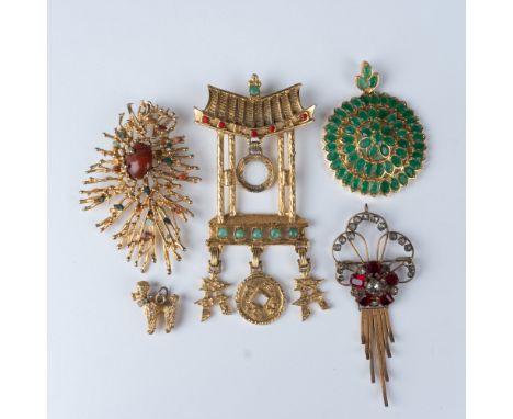 This lot features five vintage costume jewelry pieces, each showcasing unique designs. Included are a pair of ornate pins wit