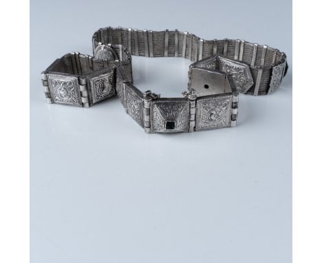 This antique Indian silver bride belt, weighing 584g, features intricate, traditional etchings and designs characteristic of 