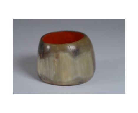 A distinctive cuff bracelet crafted from polished natural horn with a rich, organic pattern on the exterior. The interior is 