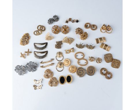 A curated collection of 28 pairs of vintage shoe clips in a variety of elegant designs, featuring gold-tone, silver-tone, and