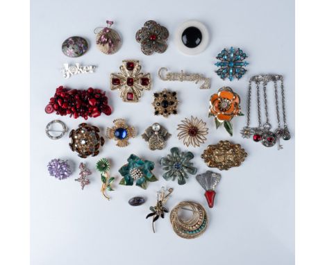 A stunning collection of 27 vintage brooches, each showcasing unique floral and statement designs. The pieces feature an arra