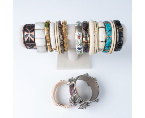 A collection of 17 vintage bangle bracelets, each featuring unique designs and materials. The assortment includes a variety o