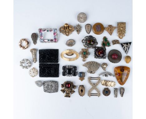 A striking collection of 39 vintage shoe clips, showcasing a wide array of styles and materials. These clips feature intricat