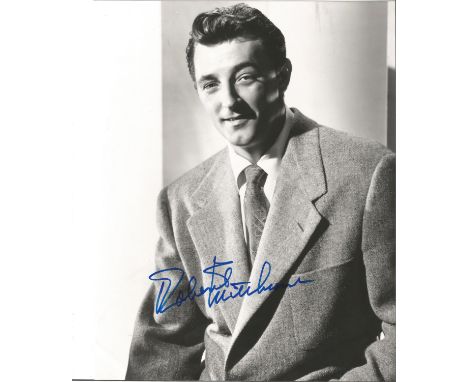 Robert Mitchum signed 10 x 8 inch b/w early portrait photo. Good condition. All autographs come with a Certificate of Authent