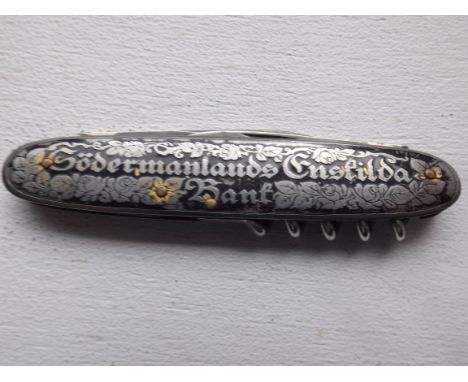 A German black enamel penknife.