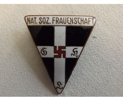 An enamel Nazi Women's League badge, to reverse "WZ 445379 Ges Gesch Steinhauer & Luck Ludenscheid R.Z.M" height 1.75 inches.