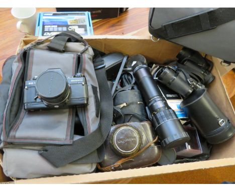Digital handy cam together with a large assortment of camera equipment, many lenses 