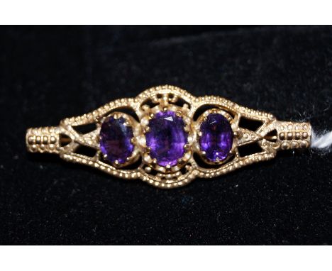 9ct Gold brooch set with three good quality amethyst 