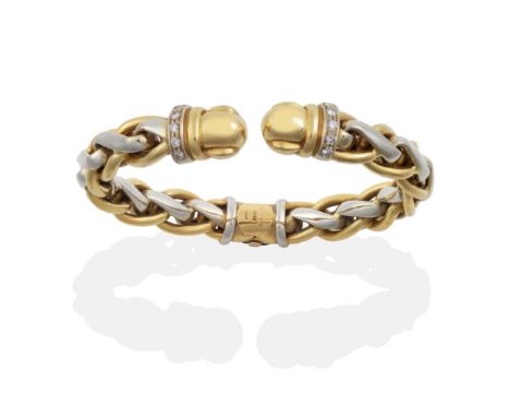 A Hinged Bangle, yellow and white entwined links, and a row of round brilliant cut diamonds towards each terminal see illustr