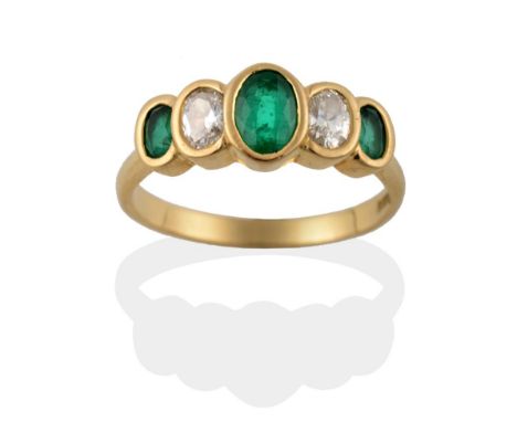 An 18 Carat Gold Emerald and Diamond Five Stone Ring, the graduated oval cut emeralds alternate with oval cut diamonds in yel