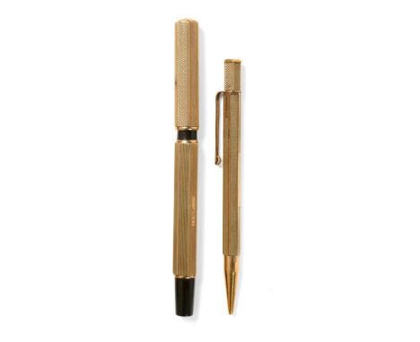 A Waterman's Ideal 9ct Gold Sleeved Fountain Pen, London 1928, of engine turned heptagonal form, the end piece inscribed J.N 