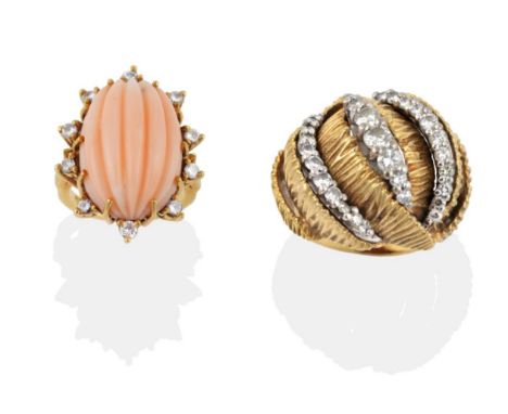 An 18 Carat Gold Diamond Set Ring, the raised textured form set with rows of graduated round brilliant cut diamonds in white 
