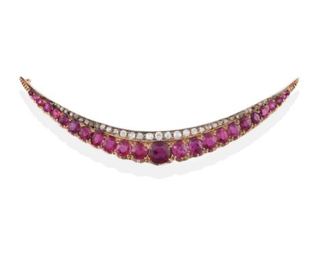 A Ruby and Diamond Crescent Brooch, circa 1900, the graduated oval and cushion shaped rubies on the outer curve, in yellow cr