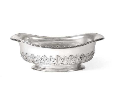 An Edwardian Oval Silver Bowl, Sebastian Garrard, London 1908, with stylised laurel border, the lower body chased with a band