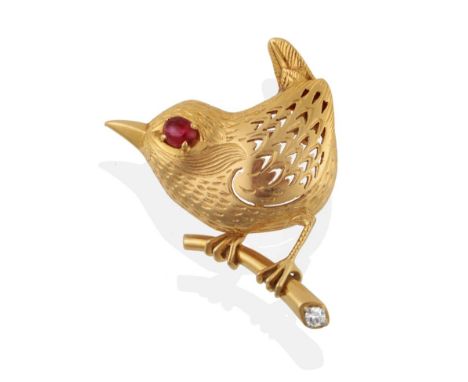 ^ A 1960's Ruby and Diamond Novelty Bird Brooch, by Cartier, modelled as a wren perched on a branch, with pierced wing, an ov